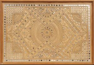 Traditional Lippan Art with intricate clay and mirror work.